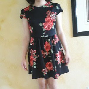 Casual above knee dress.  Black with red roses.  Comfy
